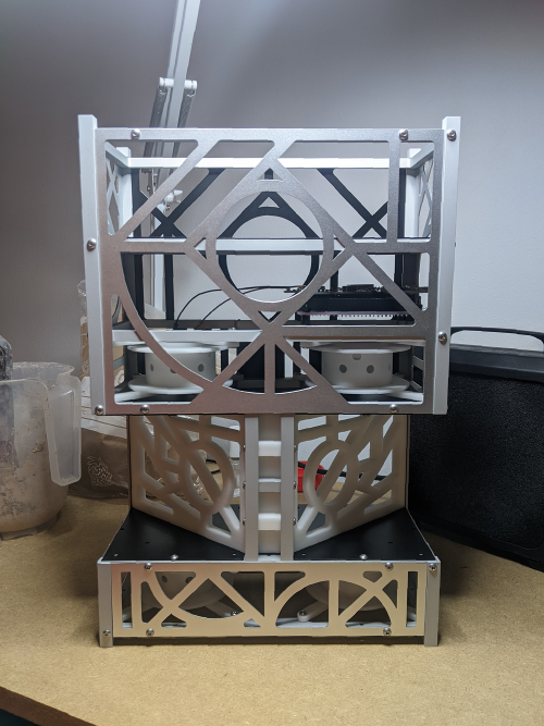 TX-2:MOONSHADOW, machined aluminum and SLS 3D printed 6U cubesat structure shown during development; design by Felipe Rebolledo; photo credit: Adriana Knouf (cell phone camera)